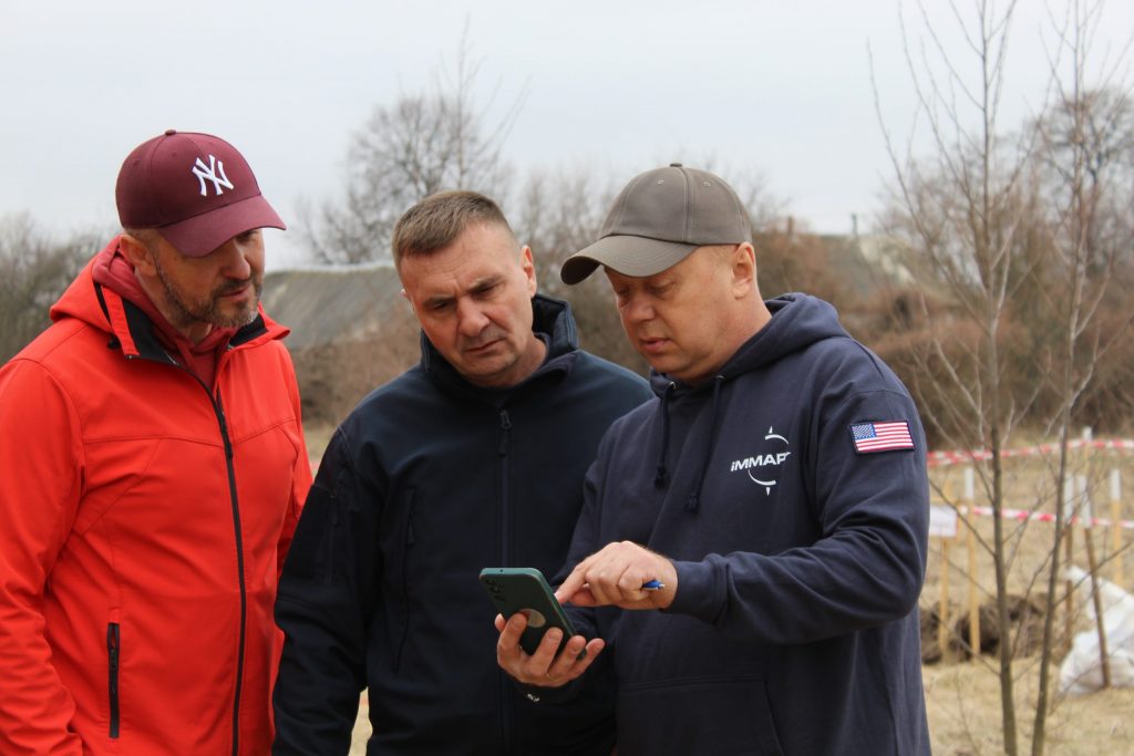 Photo 3. TPM Project Manager Mihail Semionov (left) with partners from DRC. (© iMMAP Inc. Ukraine)